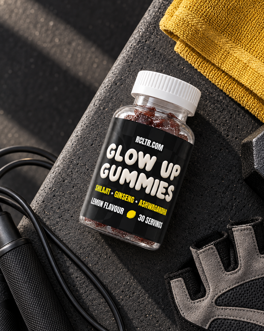 Glow Up Gummies bottle in a gym flatlay